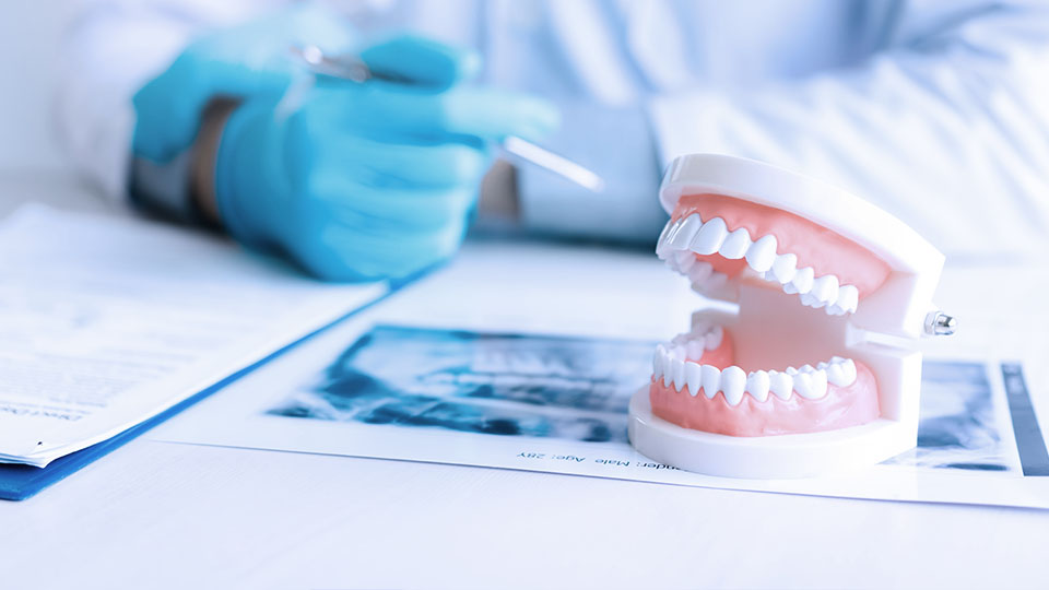 Dentist concept for children with tools in glass cup