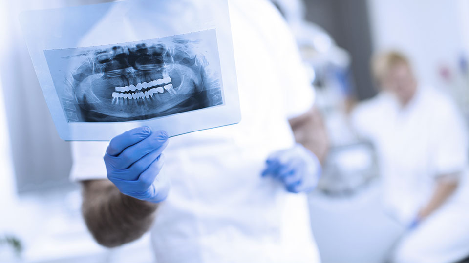Dentist concept for children with tools in glass cup